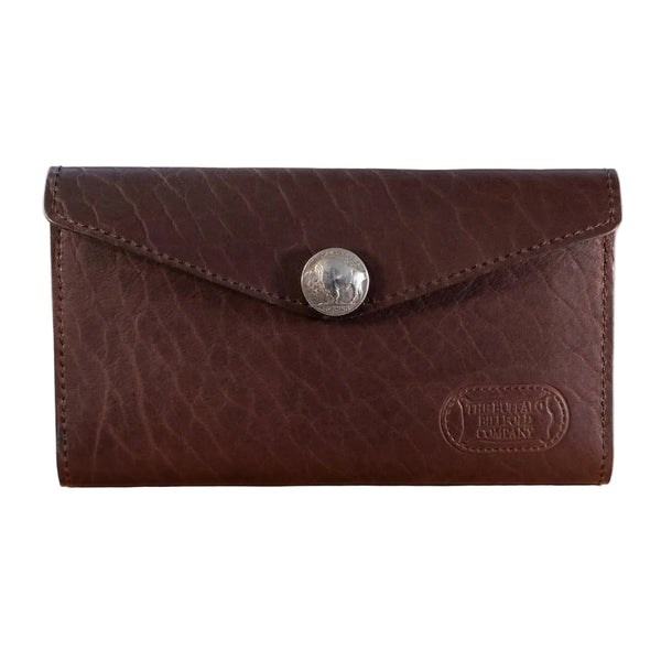 Brown leather wallet with a button on a light wooden surface